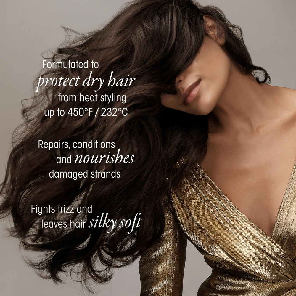 Oribe Gold Lust spray being applied to dry hair for a silky finish