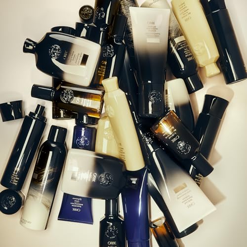 Oribe Gold Lust spray close-up showing texture and spray mist
