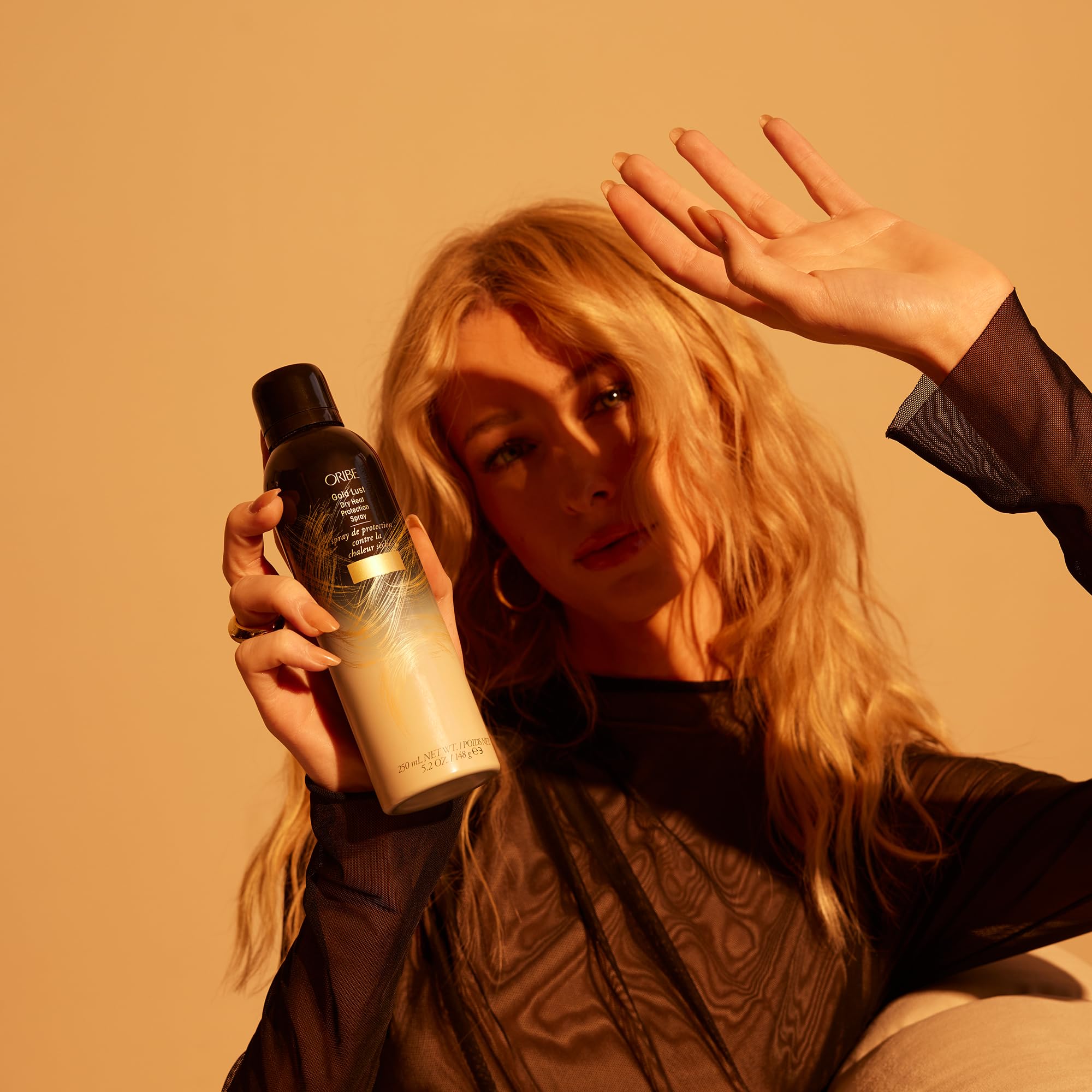 Oribe Gold Lust spray mist used for frizz-free results