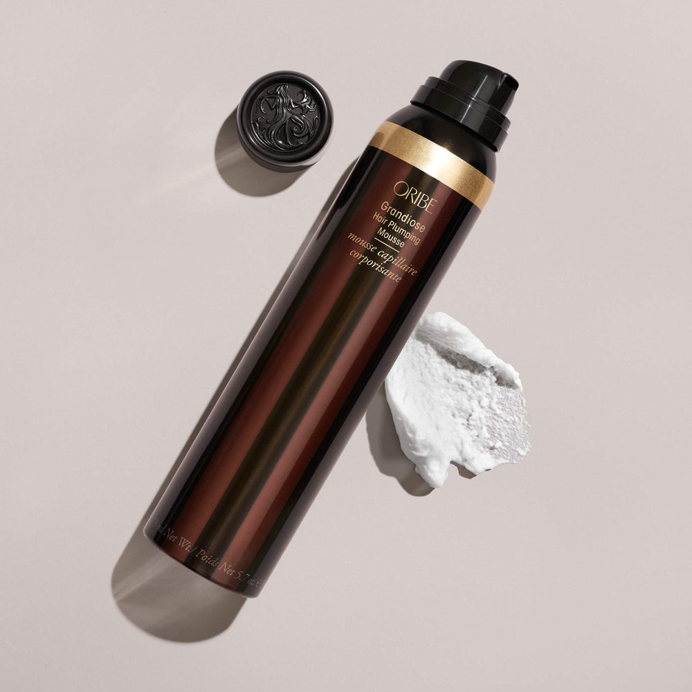 Oribe Grandiose Mousse texture delivers soft, touchable lift without stiffness.