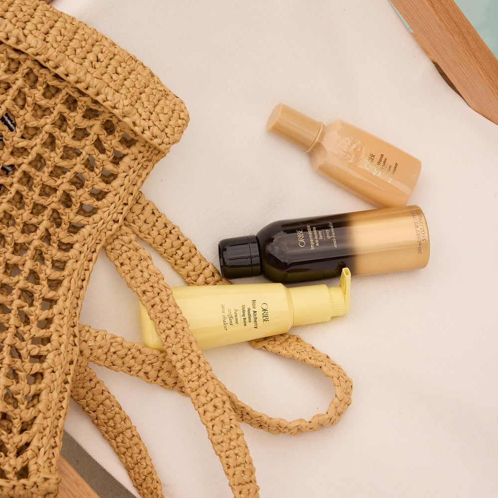 Oribe Impermeable spray finish light-hold shot shows finishing mist for sleek looks.