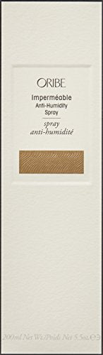 Oribe Impermeable spray frizz shield close-up demonstrates fine mist for frizz control.