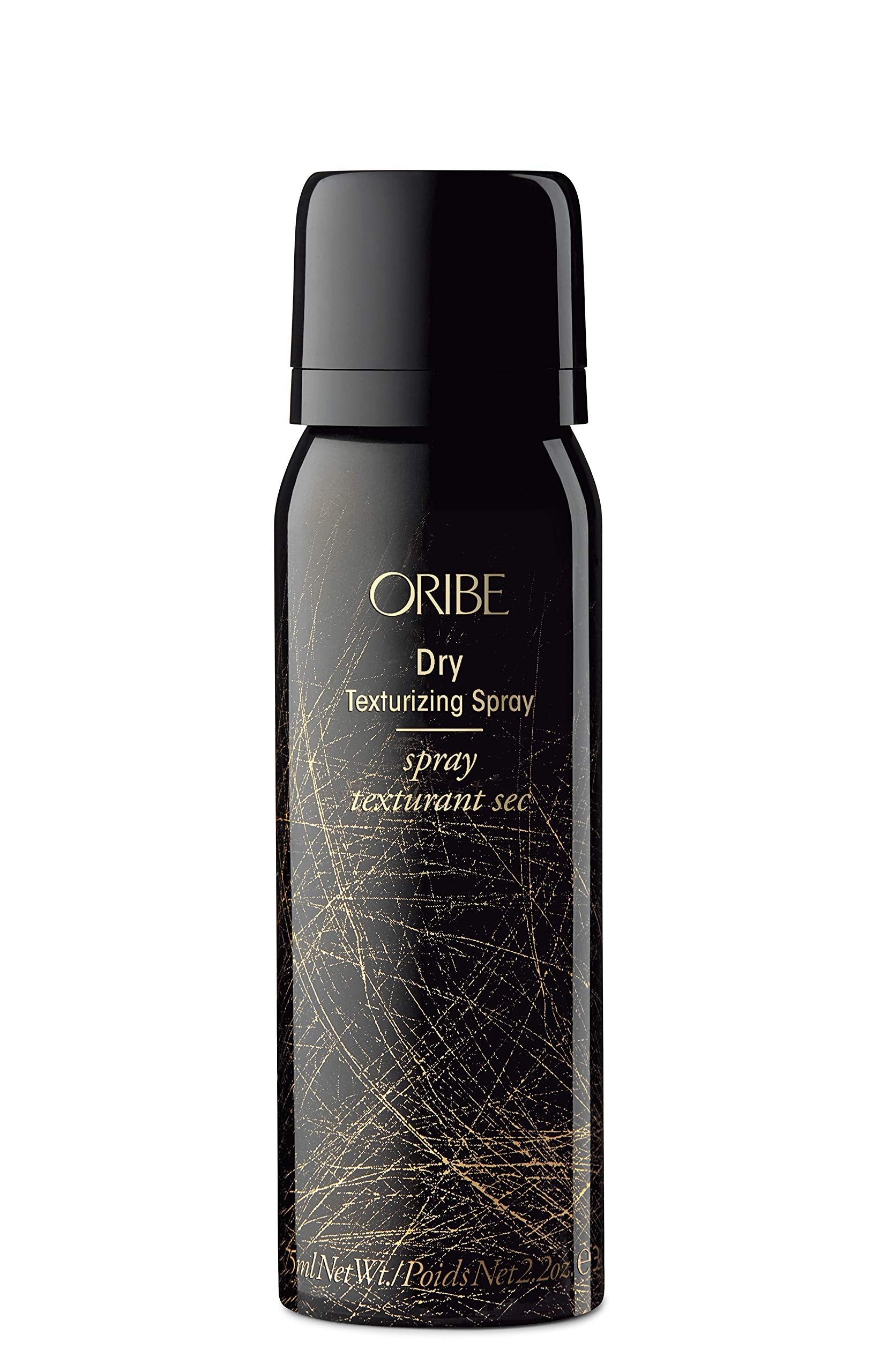 Oribe Obsessed Set flatlay with mini bottles and lifestyle elements.