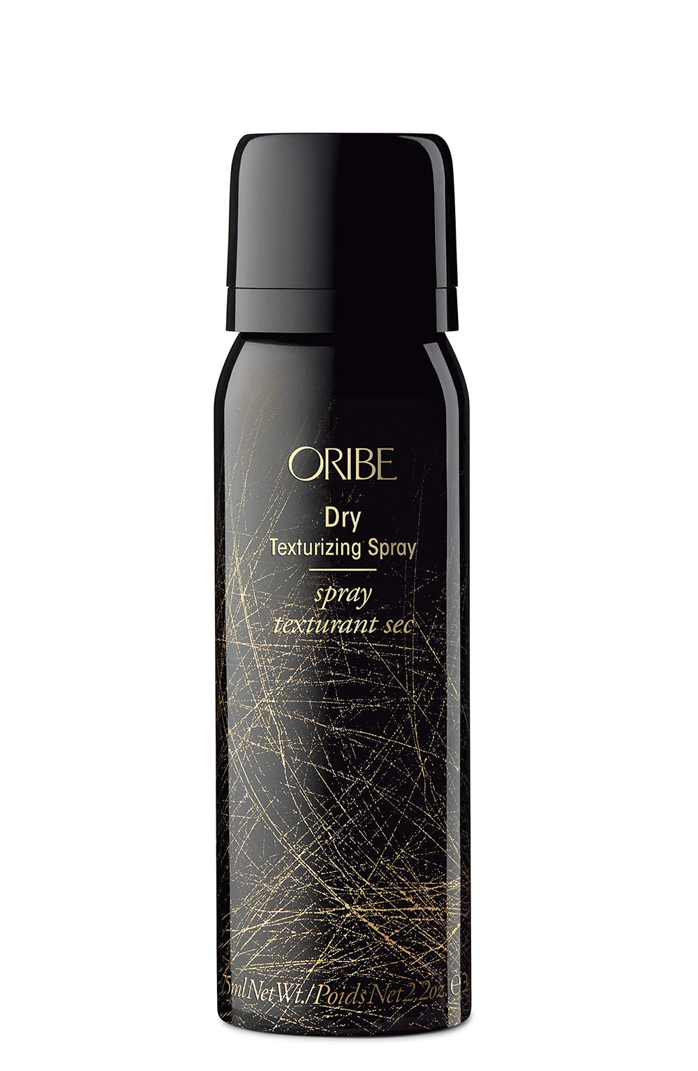 Oribe Obsessed Set flatlay with mini bottles and lifestyle elements.