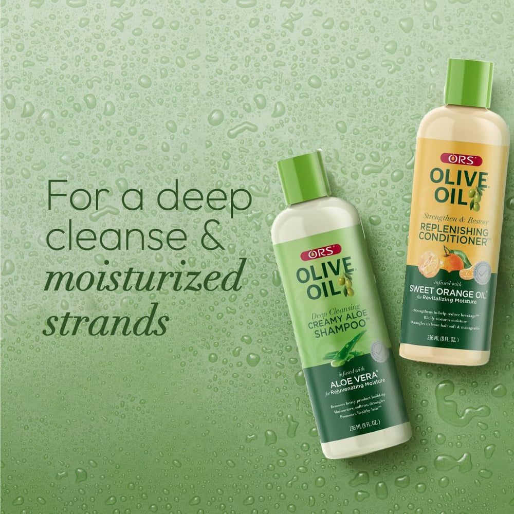 ORS Olive Oil Creamy Aloe Shampoo label close-up showcases premium cleansing formulation.