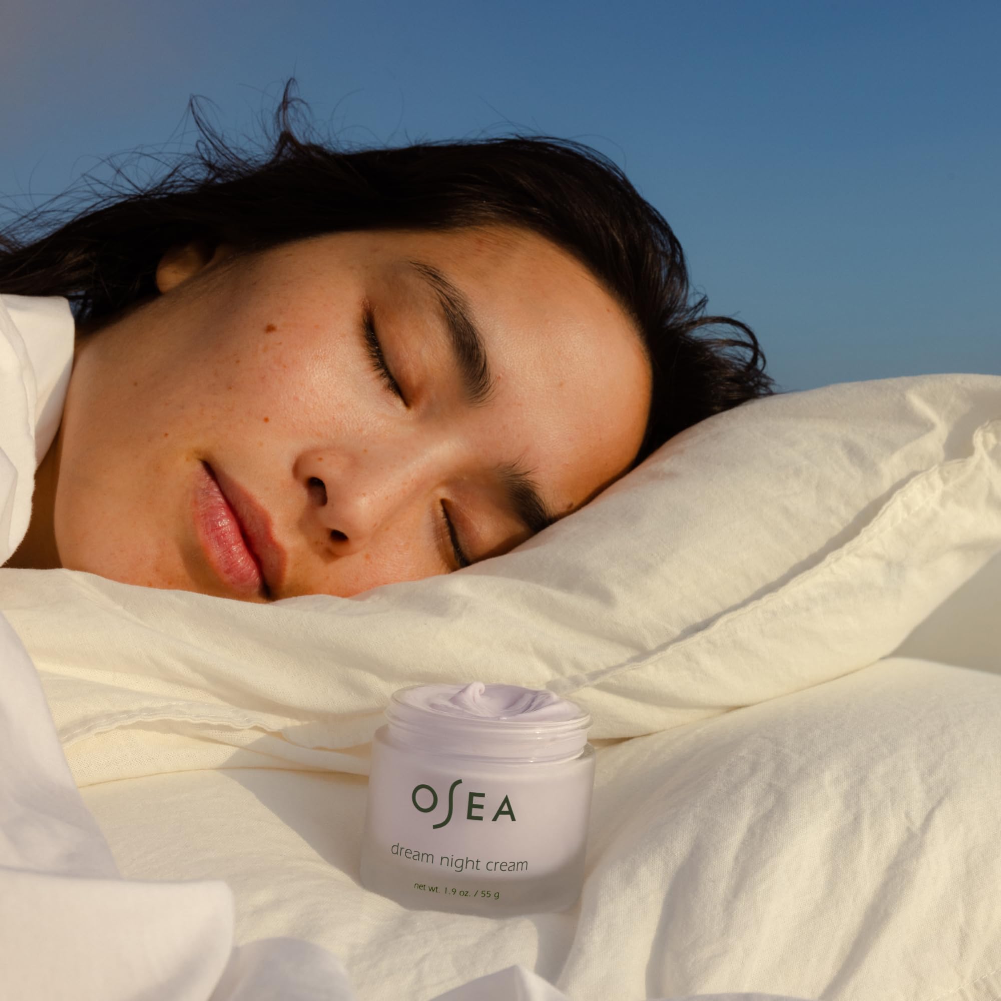 OSEA Dream Night Cream massaged along the neck for even tone.