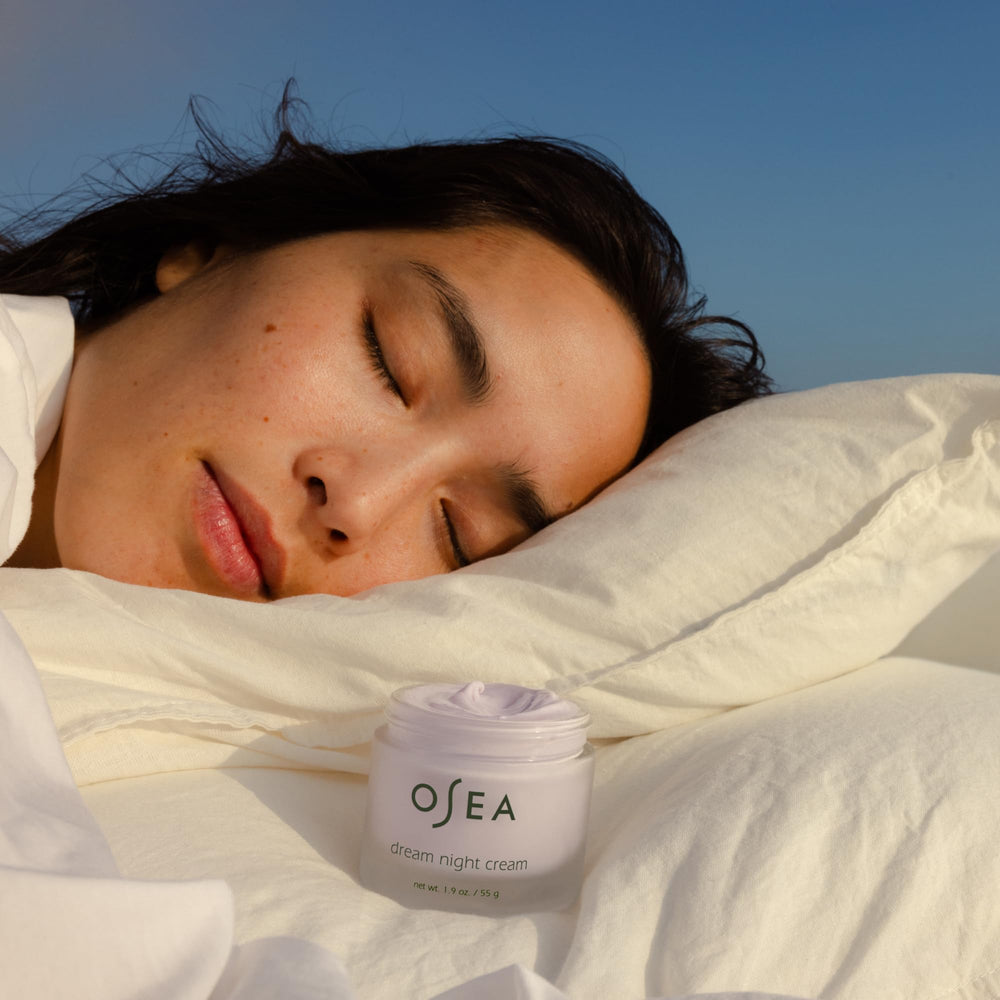 OSEA Dream Night Cream massaged along the neck for even tone.