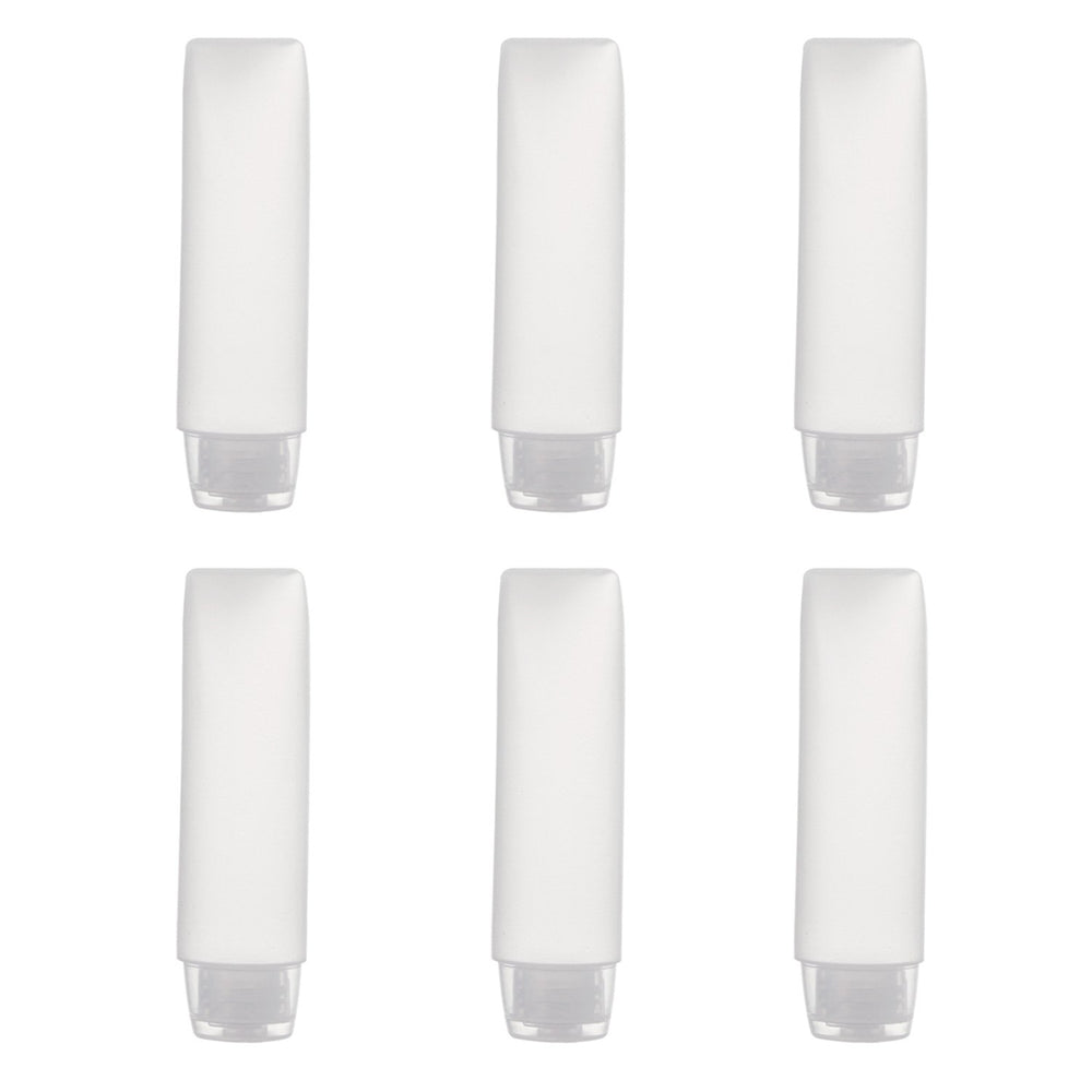 OTO transparent bottles arranged for travel kit and easy packing.