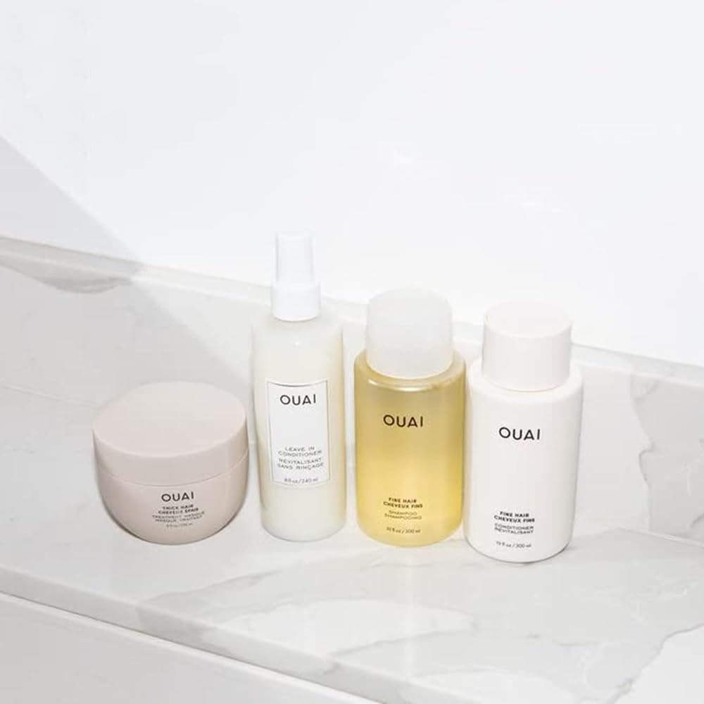OUAI bathroom setup—sleek in-shower display promoting effortless routine.