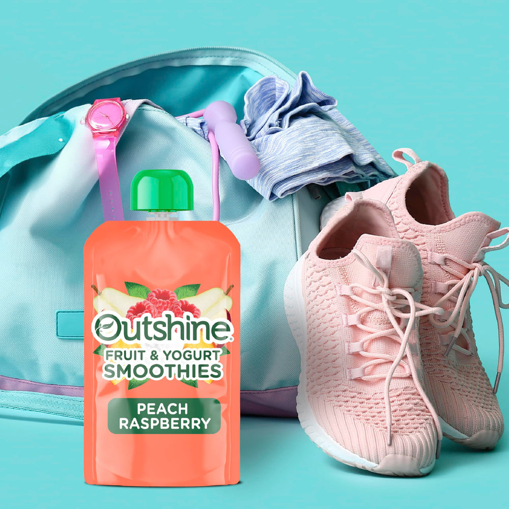 Outshine Smoothie Raspberry Peach pouch being poured into a glass for a refreshing sip.