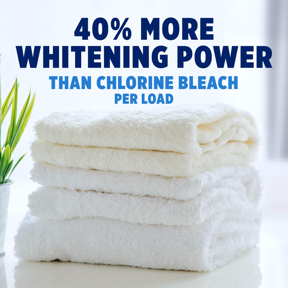 Pouring Oxiclean White Revive into the wash for brighter whites