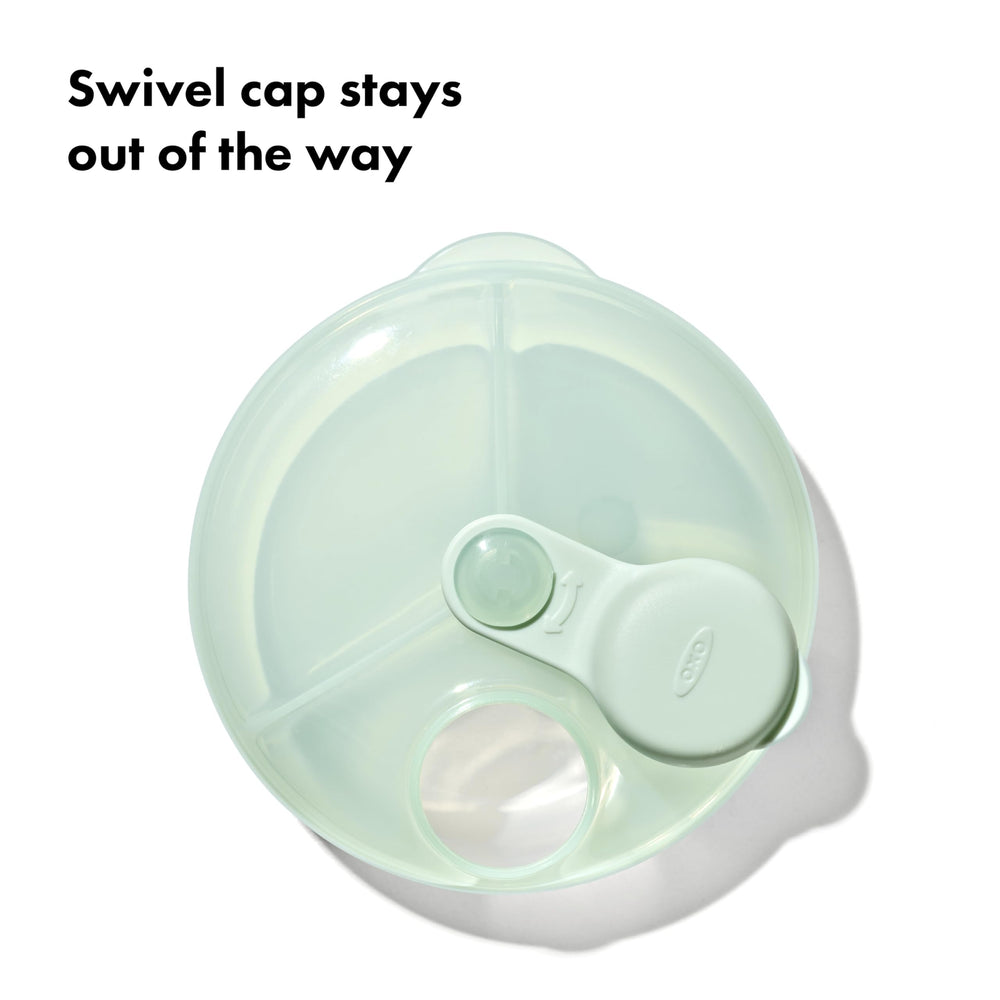 OXO Tot Formula Dispenser easy one-handed pouring in use.