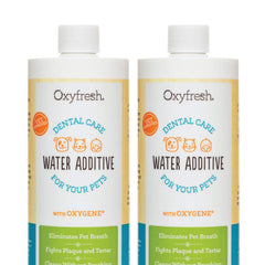 Oxyfresh premium pet dental water additive bottle being poured for easy daily care.