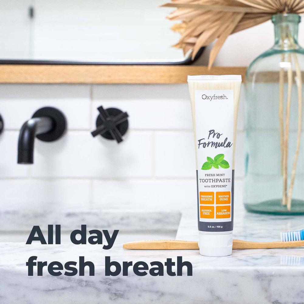 Ingredients list on Oxyfresh Pro Formula Fresh Mint toothpaste emphasizing natural essential oils
