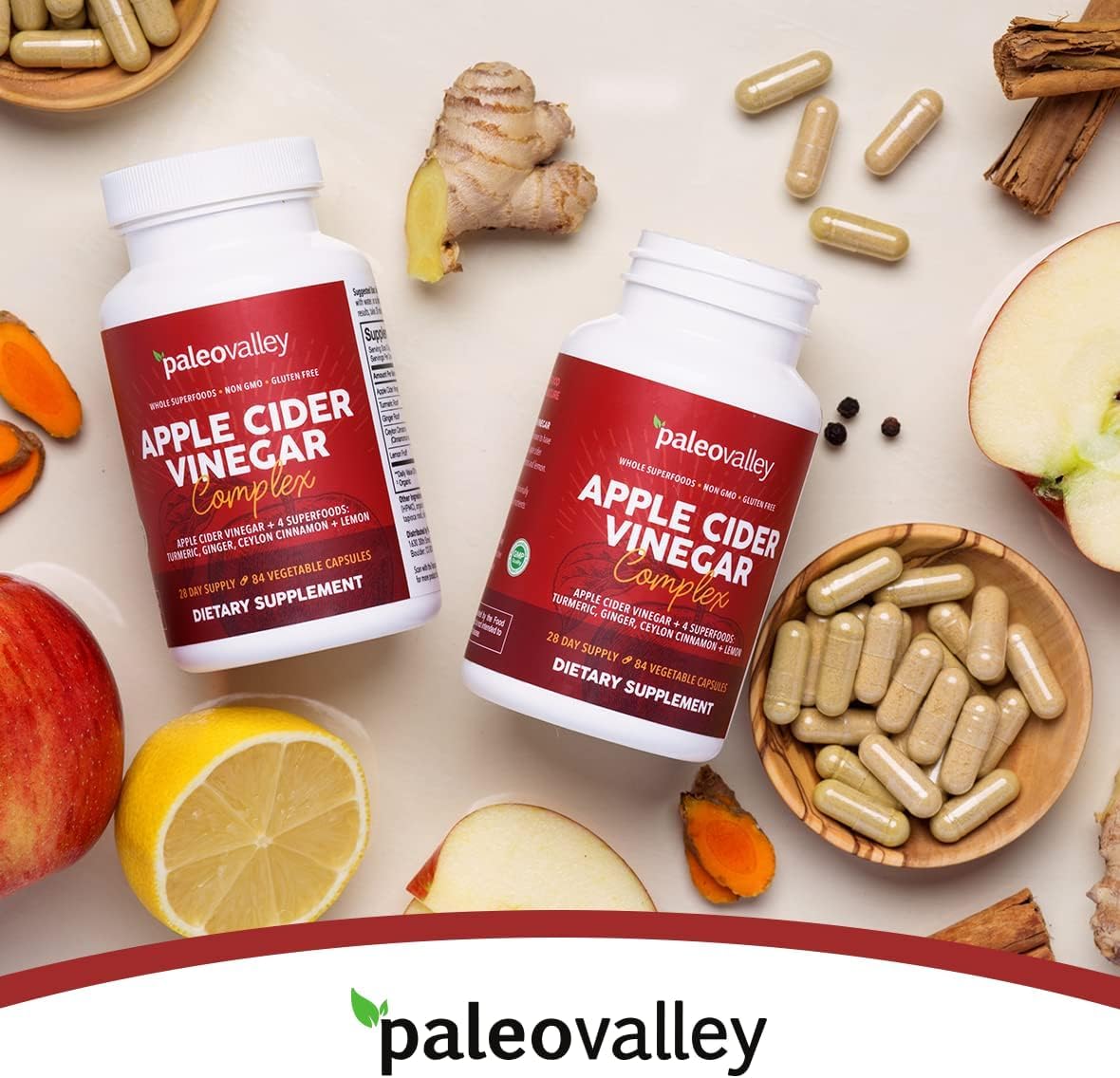 Paleovalley Apple Cider Vinegar Complex on a kitchen counter with lemon and ginger, highlighting natural superfood blend.