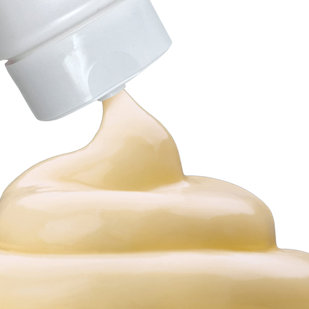 Large family-size Palmer's lotion bottle on bathroom shelf.