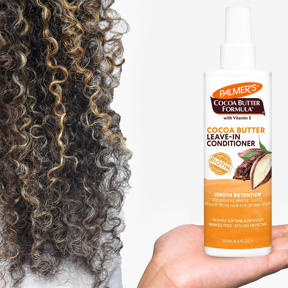 Close-up of Palmer's detangling action on curly hair after application.