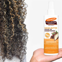 Close-up of Palmer's detangling action on curly hair after application.