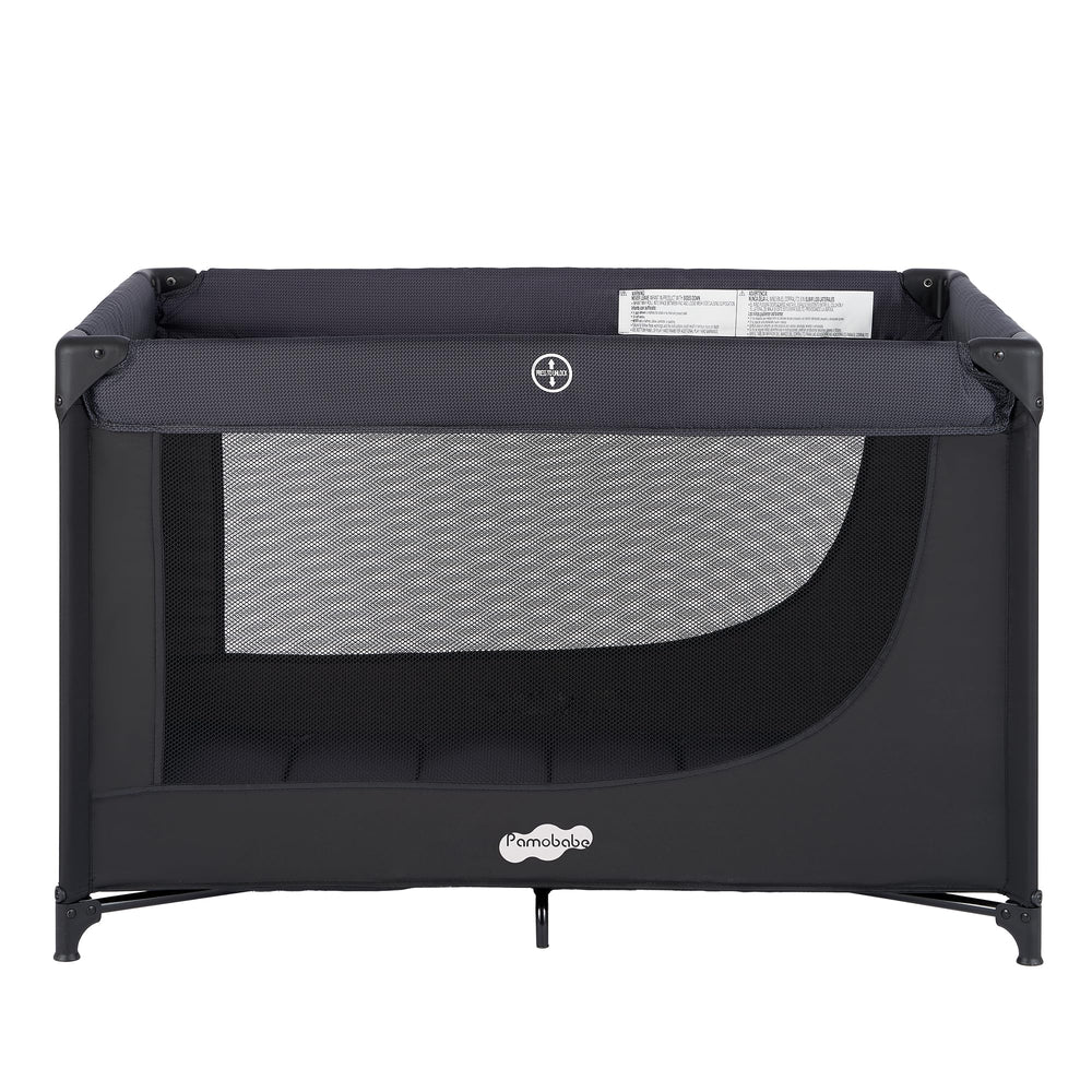 Pamo Babe compact pack and play set up in a living room