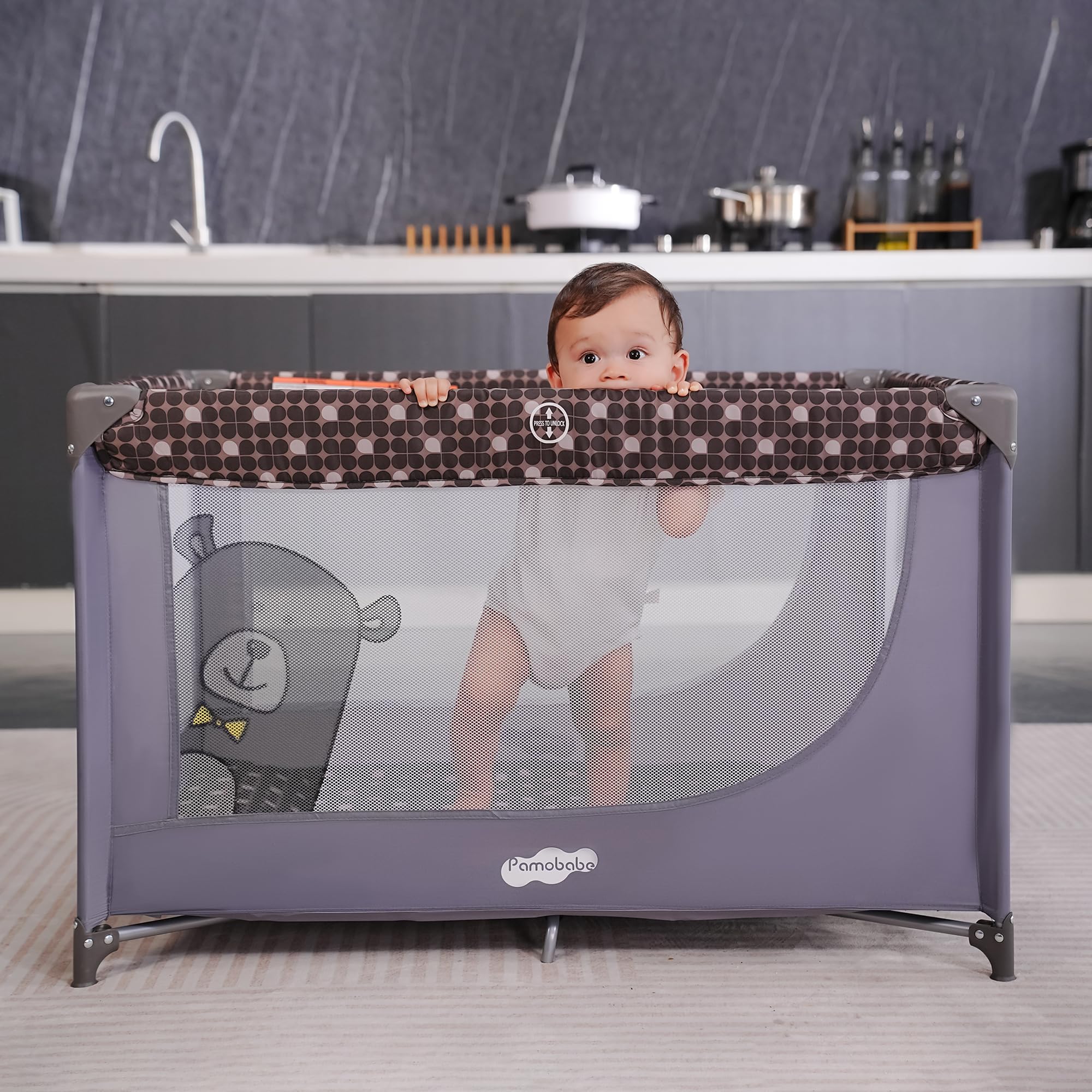 Pamo Babe soft mattress pad inside the play yard for comfort.