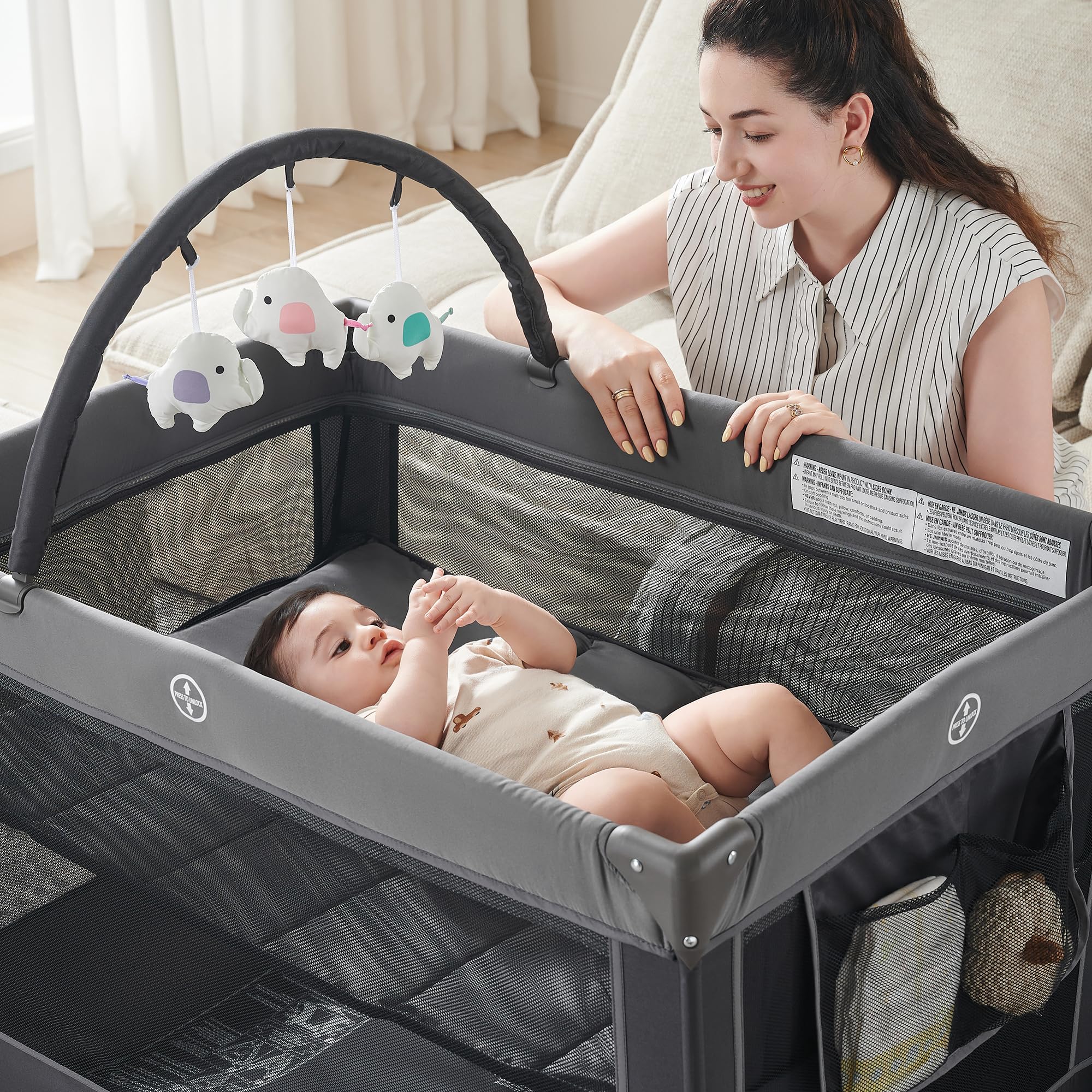 Pamo Babe playpen in a cozy living room setting