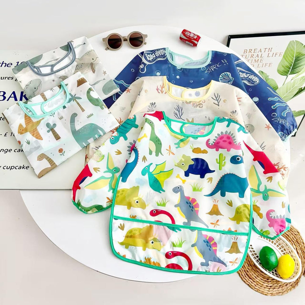 PandaEar waterproof front protects outfits during mealtimes and crafts.