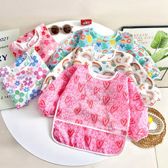 PandaEar long sleeve bib pink pocket demonstrates crumb catcher during eating