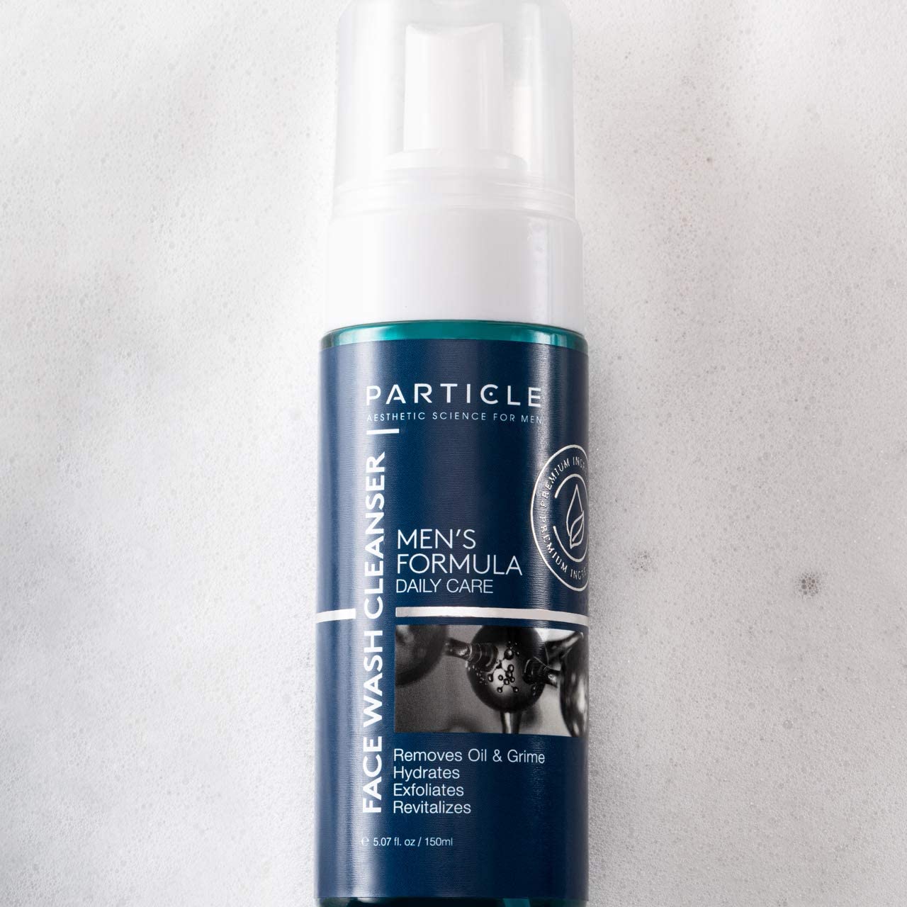 Packaging design of Particle Face Wash box beside bottle.