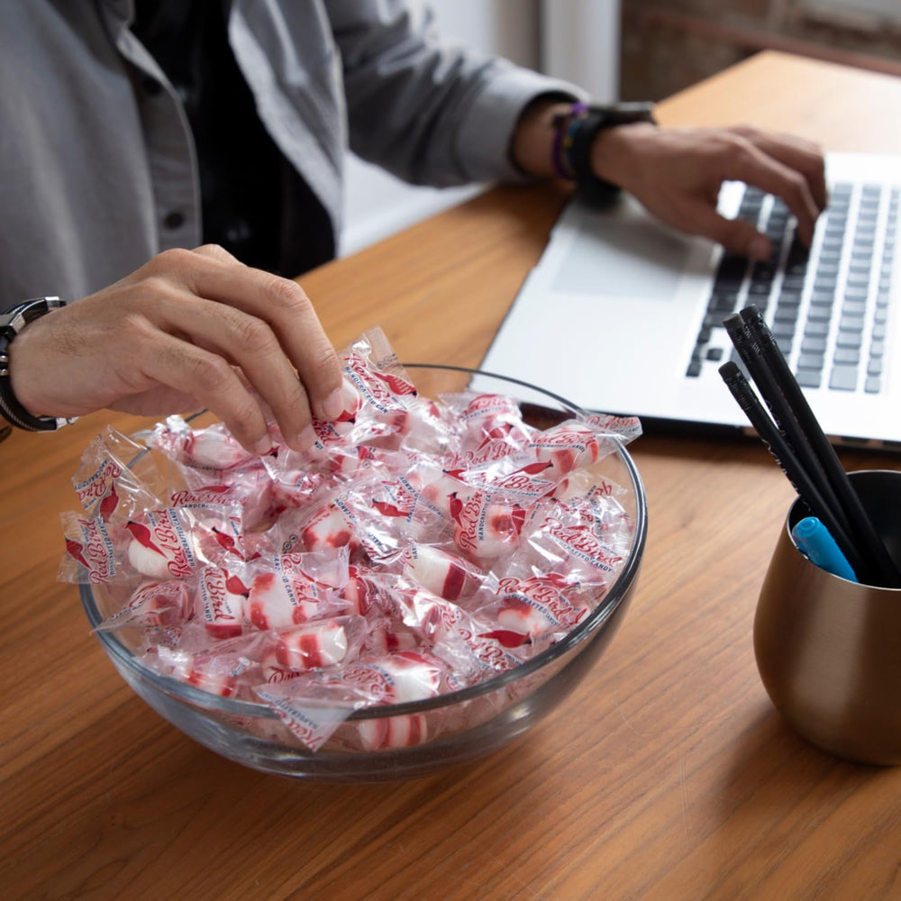 Party bowl setup featuring Red Bird mints for guest enjoyment.