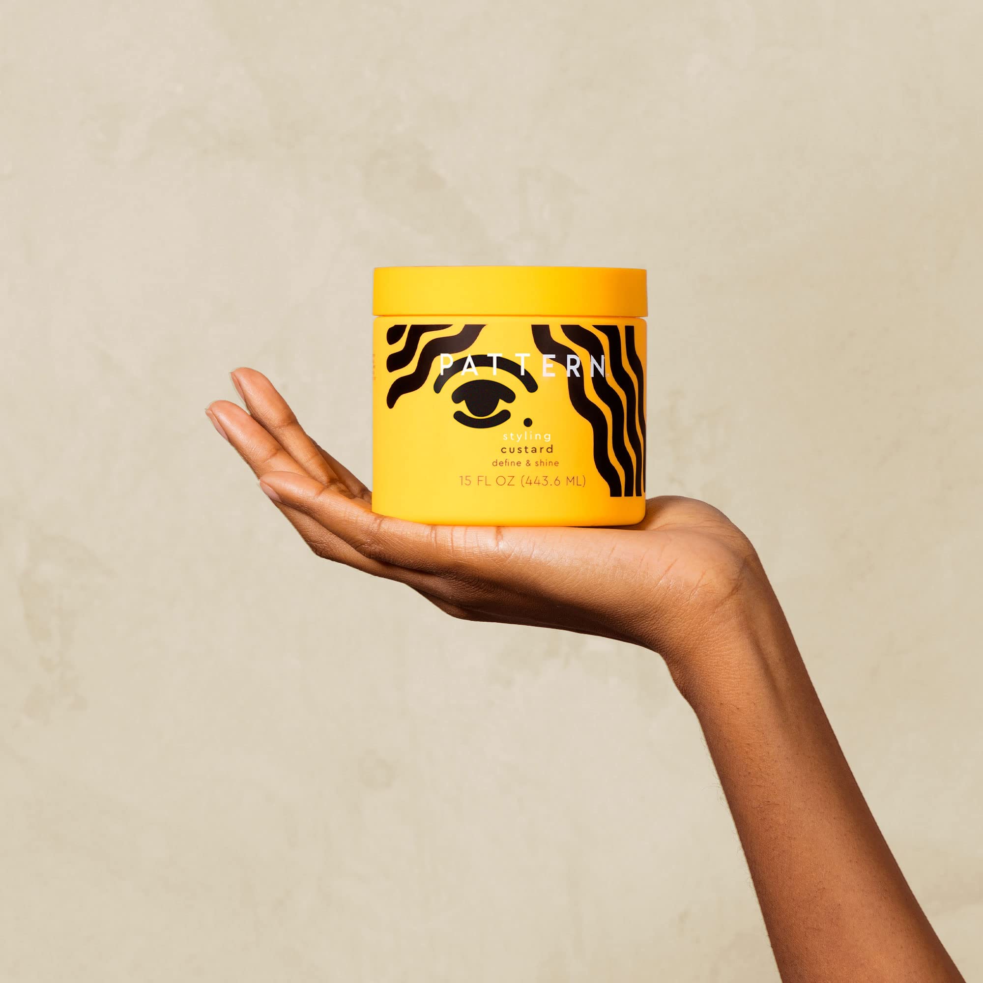 PATTERN Styling Custard applied to hair for defined, hydrated curls.
