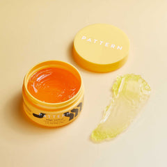 Hands applying PATTERN Edge Control to curls for easy daily reapplication
