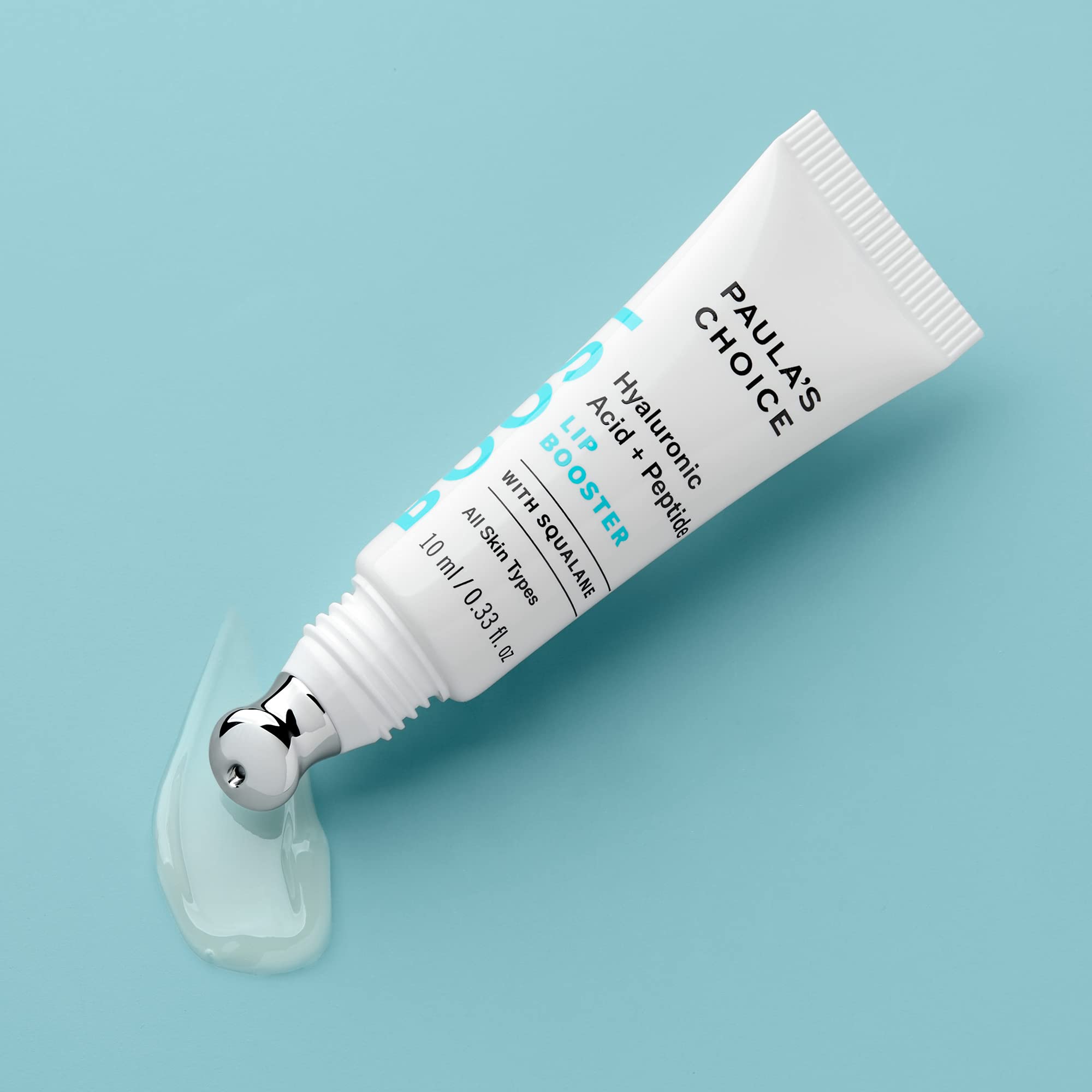 Paula's Choice Lip Booster texture close-up highlights hyaluronic acid hydration.