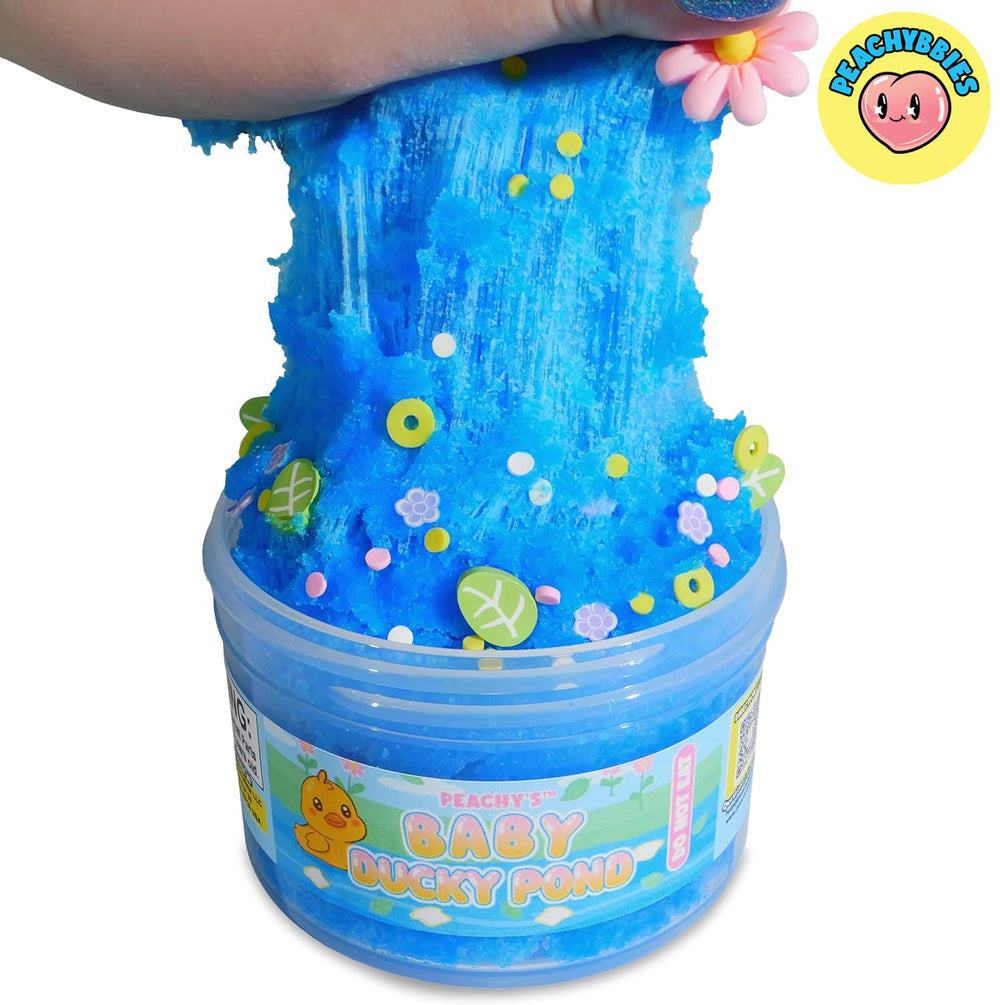 Peachybbies slime with flower sprinkles and leaves evokes a spring pond vibe
