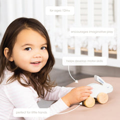 Pearhead gray wooden bunny with rolling feet for smooth motion.