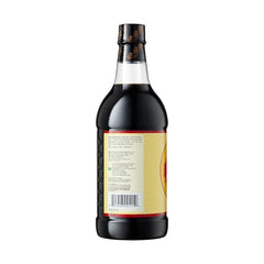Pearl River Bridge Light Soy Sauce bottle during busy stir-fry cooking.