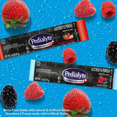 Pedialyte AdvancedCare Plus powder packets with scoop dissolving in glass.