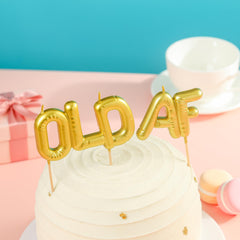 PHD CAKE gold-finish candles add elegant sparkle to desserts.