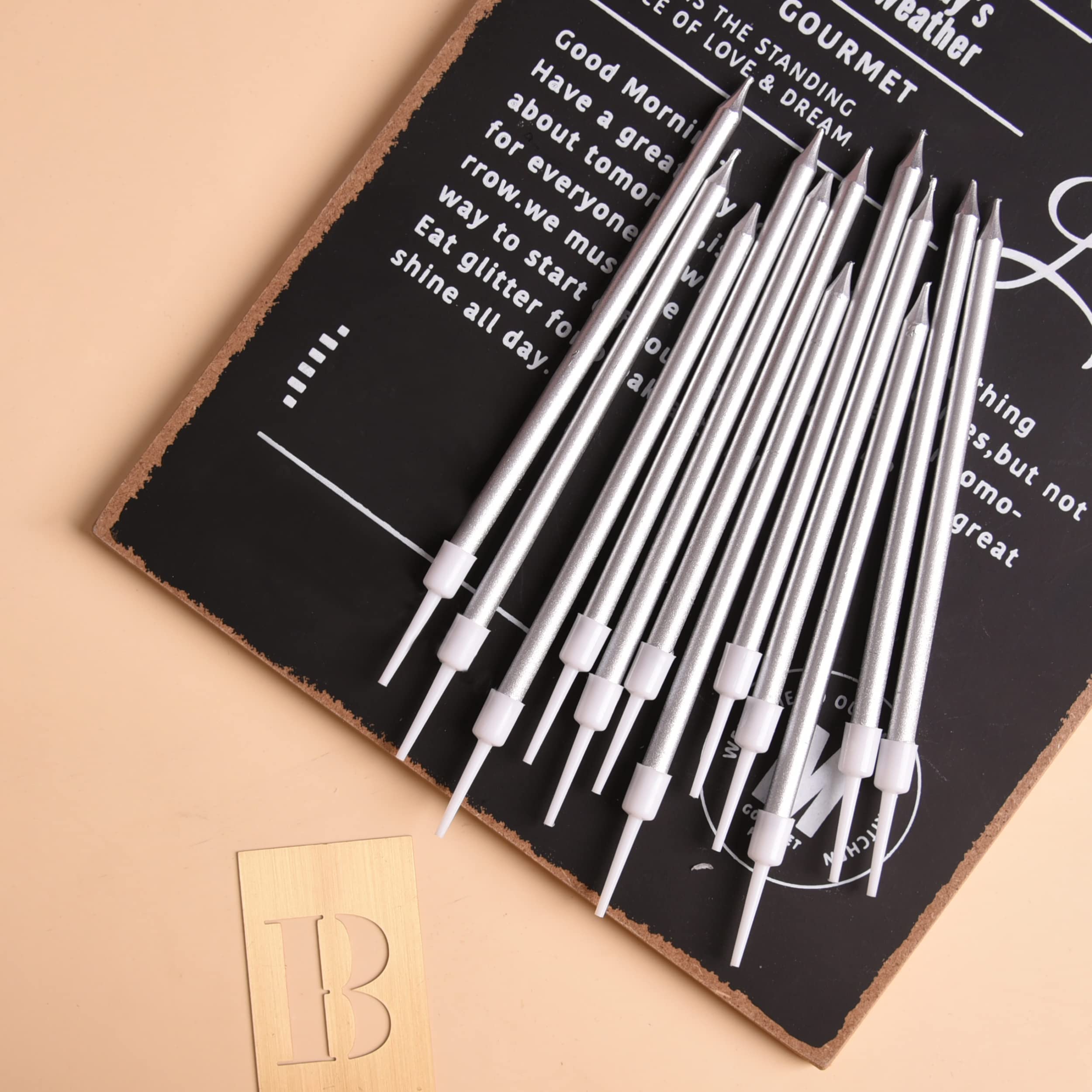PHD CAKE silver tapered candles on a wedding cake creating a refined display