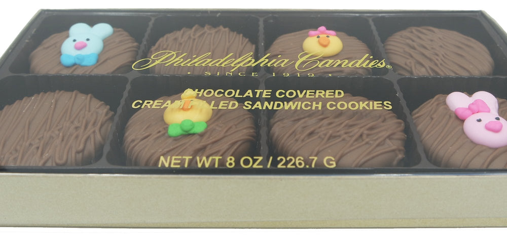 Philadelphia Candies OREO cookies with chick faces for festive snacking.