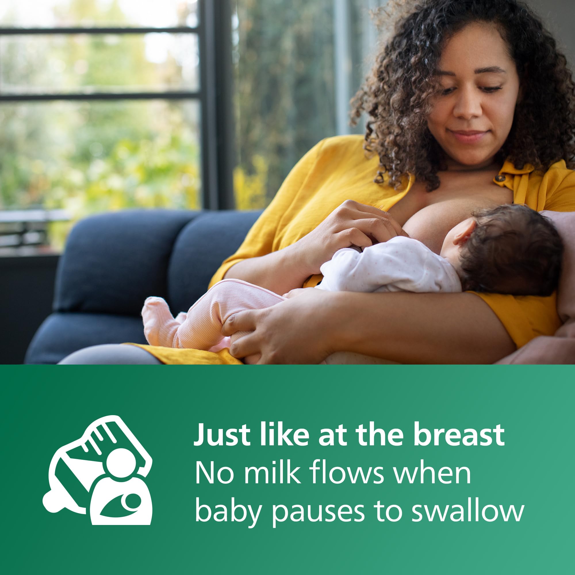 Philips Avent 8oz glass bottle in use during feeding.