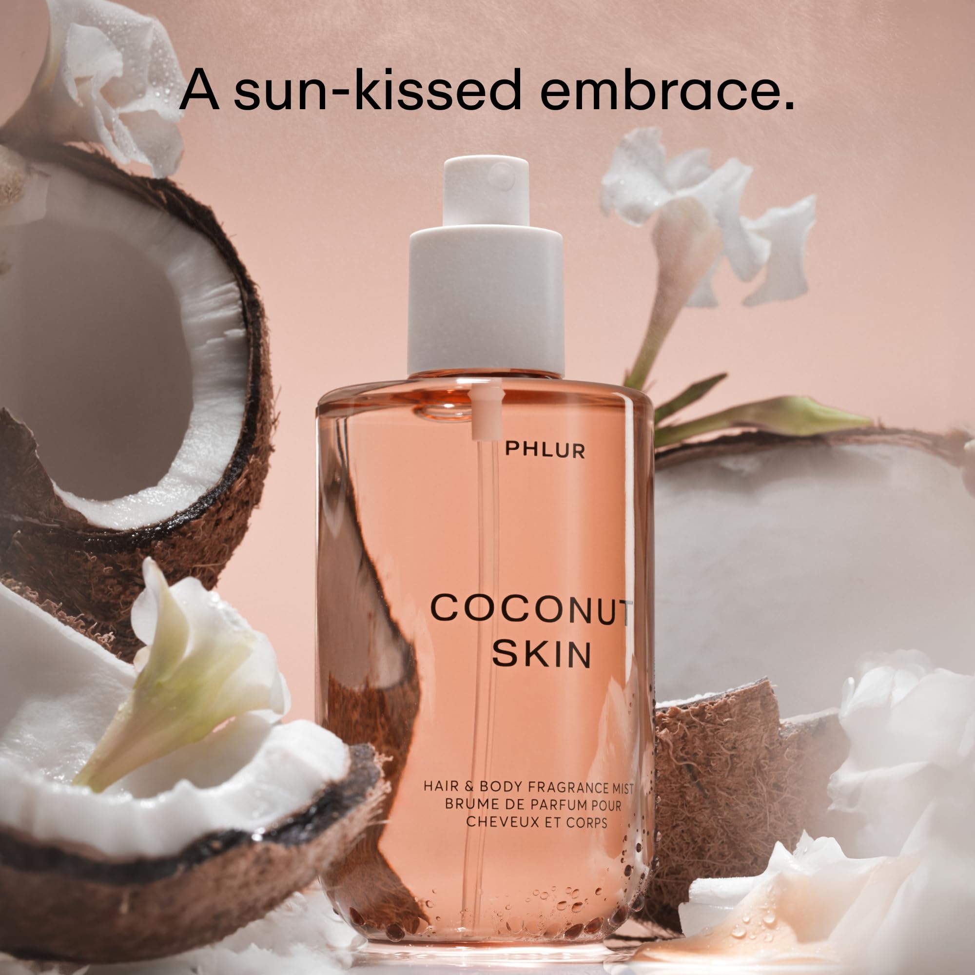 PHLUR Coconut Skin Body Mist spray action showing mist dispersion for daily wear.