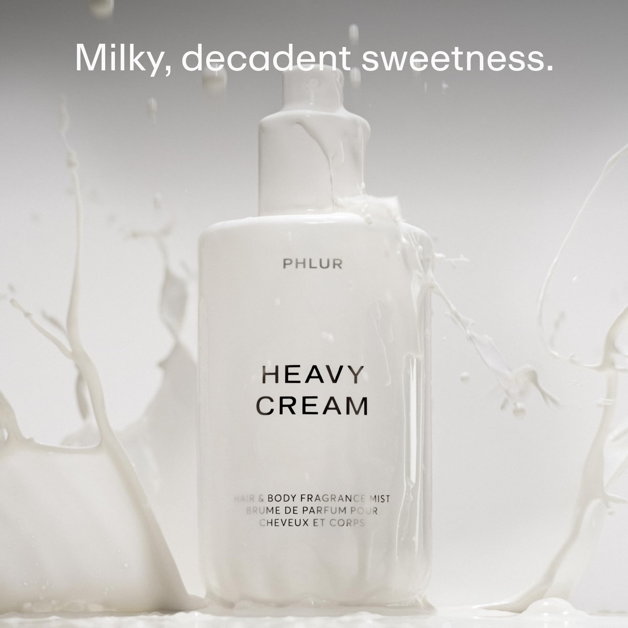 PHLUR Heavy Cream Body Mist spray on hair for subtle scent without overpowering.