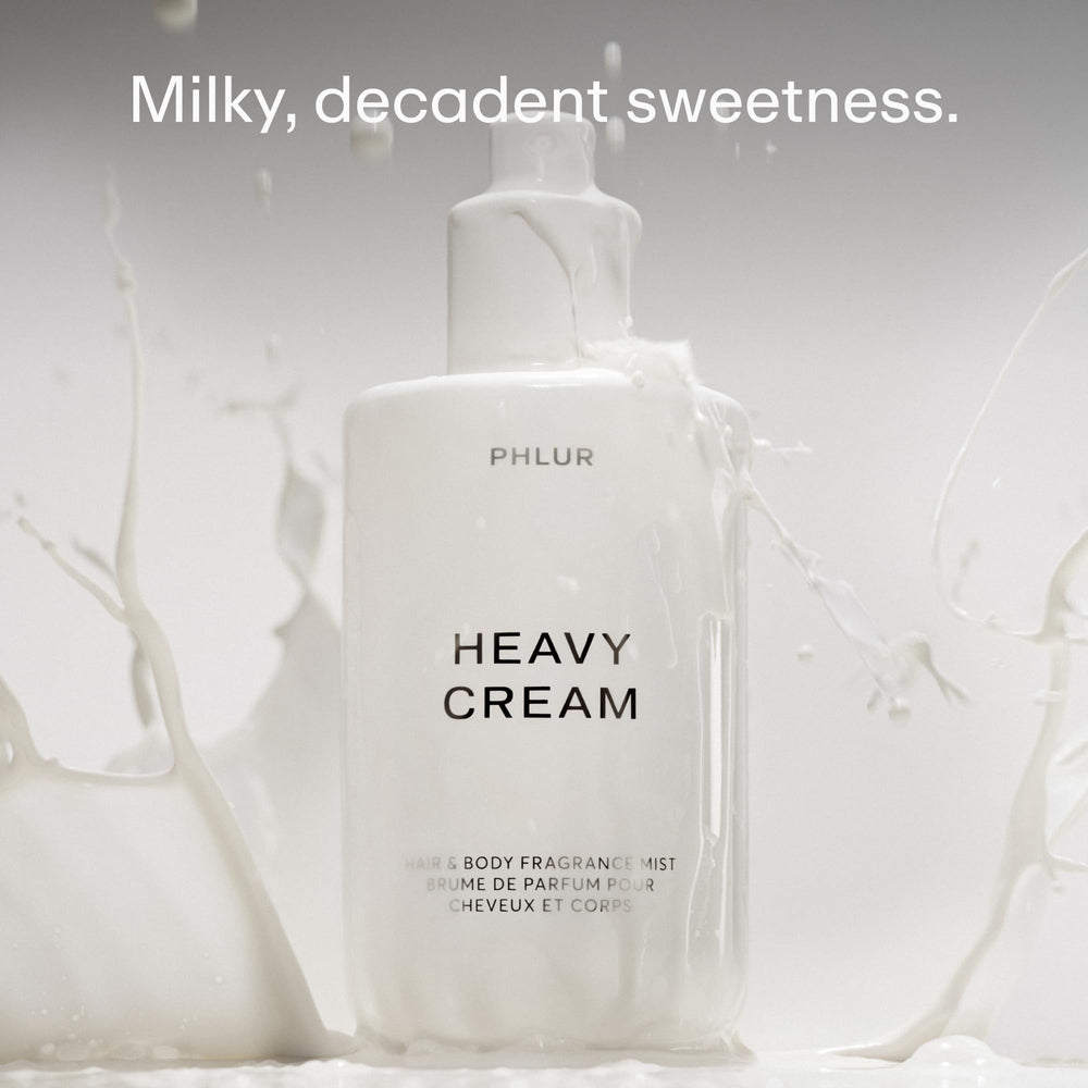 PHLUR Heavy Cream Body Mist spray on hair for subtle scent without overpowering.