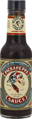 Pickapeppa Sauce bottle pour showcasing bold, versatile flavor for seafood, salads, and cheese dishes