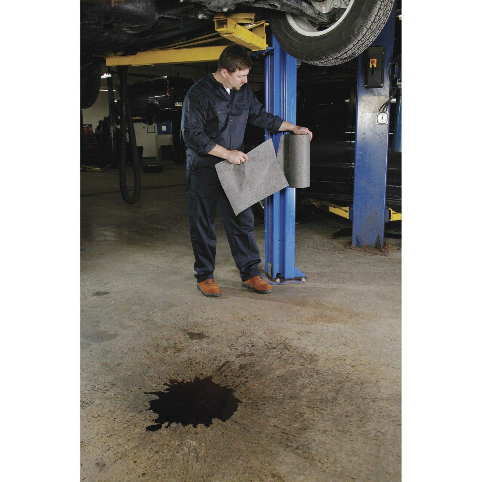 PIG Mat Roll absorbing oil and coolants to keep the workspace clean