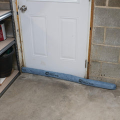 PIG mildew-resistant absorbent sock under freezer catching leaks and condensation.