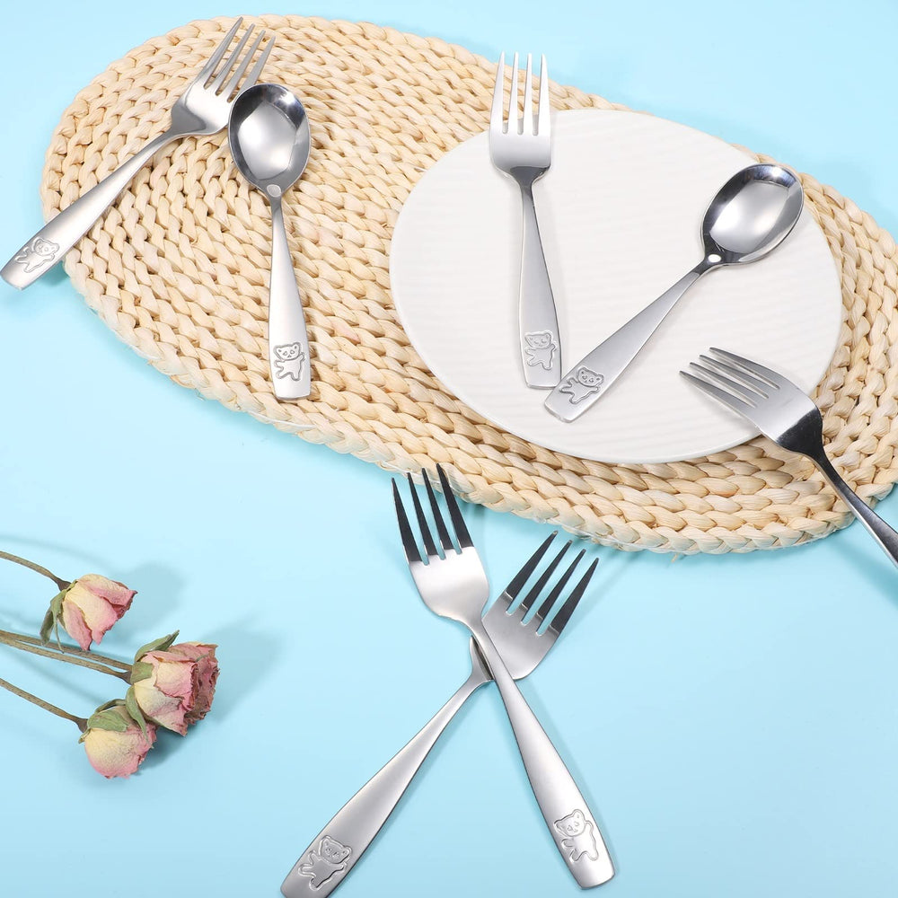 Pimoys bear-engraved spoons add fun to mealtime.