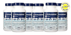 Pink Rhyme Steramine tablets dissolving in blue water demonstrates visible cleaning action
