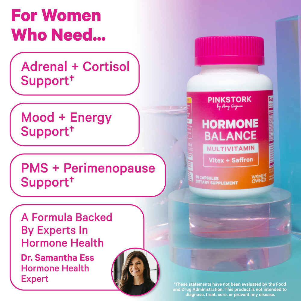 Pink Stork Hormone Balance capsules dispensed in hand for easy daily use and planning.
