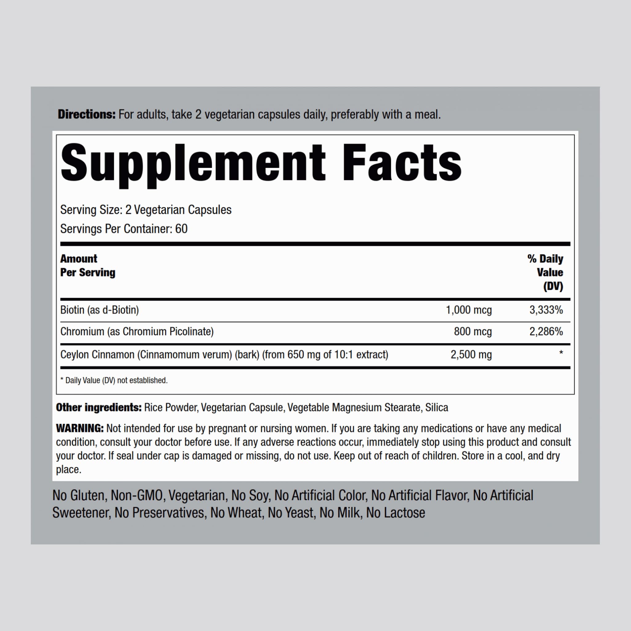 Piping Rock cinnamon capsules close-up label, emphasizing vegetarian non-GMO formulation.